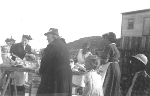 400: Garden party, Eliz (Reddy) Carroll (facing at left, dark dress), Julia (Reddy) McCarthy (center,  front), Mary (Emberly) Webber (right, with polkadot dress). Liz Carroll lived 'two cabbage gardens'  away from Julia McCarthy. [courtesy of Madonna (Healey) McCarthy]  - Mary daughter of Michael Reddy &amp;amp; Elizabeth Fagan, married John Carroll; Julia daughter of  James Reddy &amp;amp; Mary Anne Murphy, married James McCarthy; Mary (Emberley) married John Webber